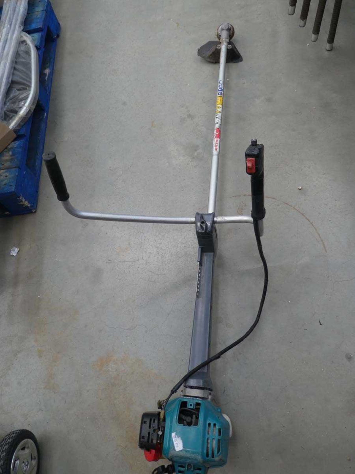 +VAT Makita petrol powered double handled brush cutter