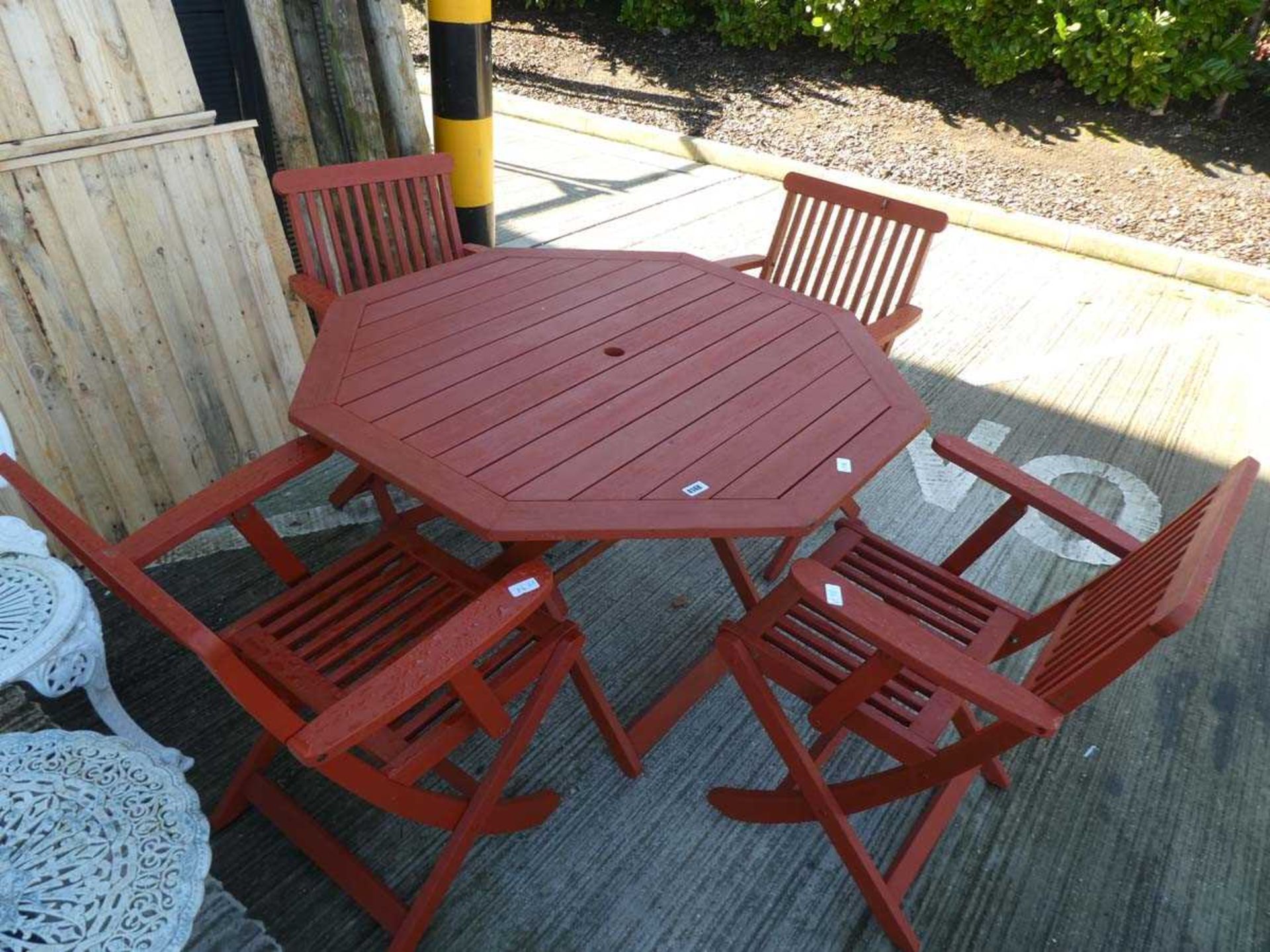 Hexagonal wooden garden table and four matching chairs