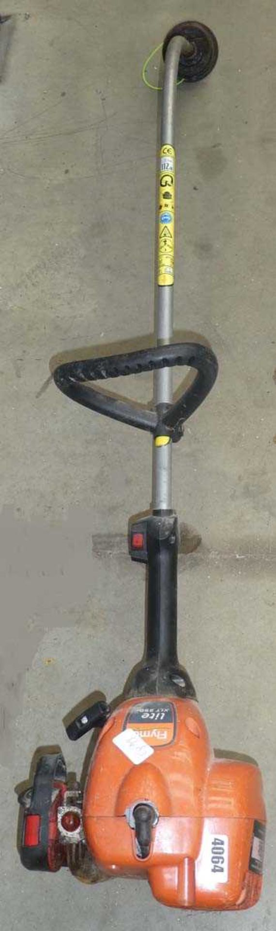 Flymo petrol powered bent shaft strimmer