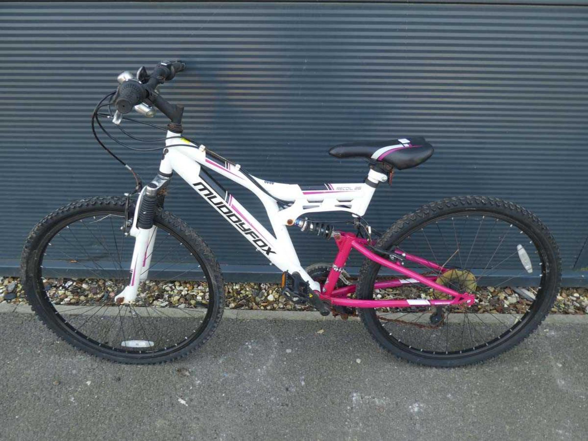 White and pink Muddyfox girls mountain bike