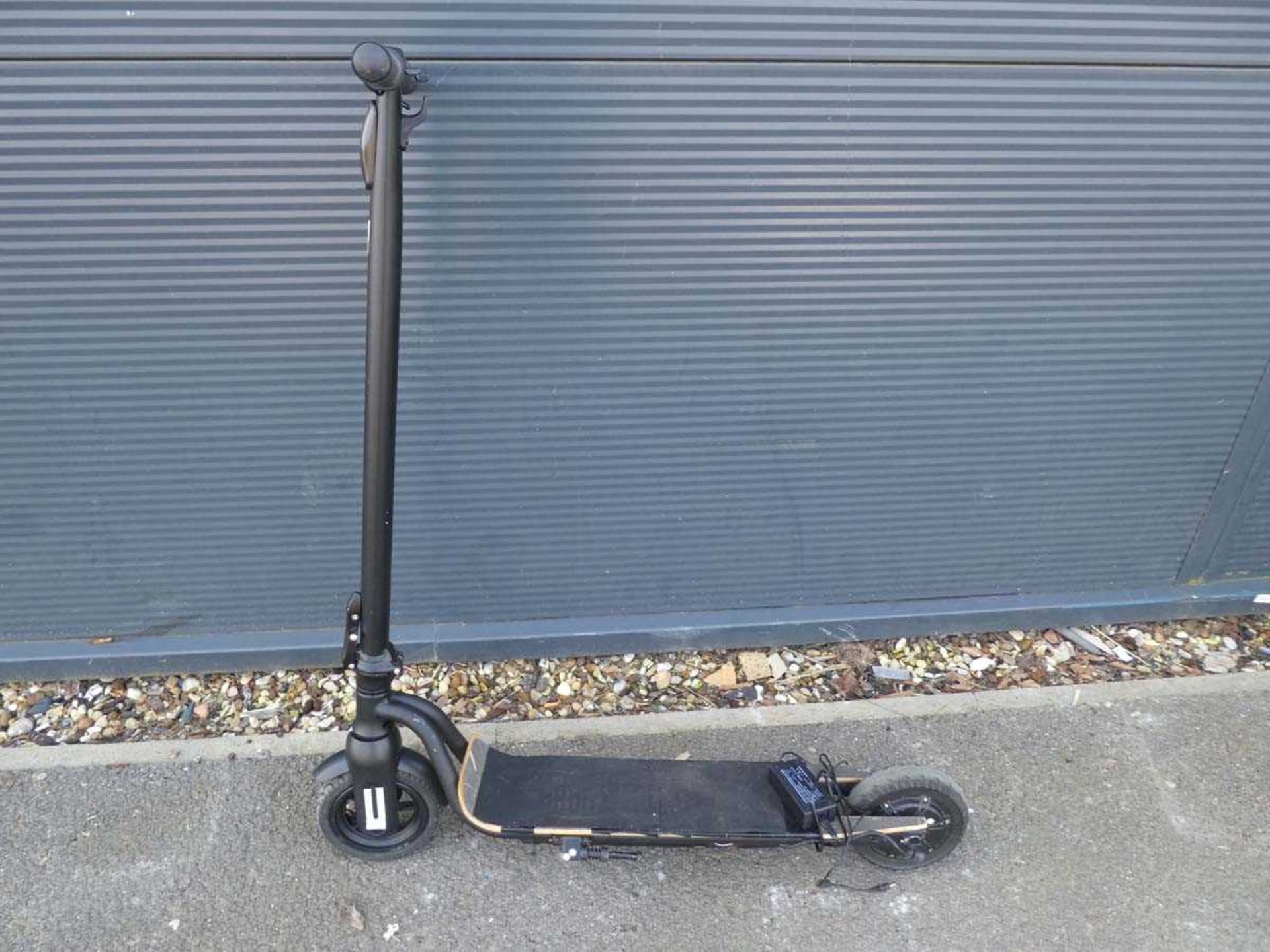 Black fold up electric scooter with charger