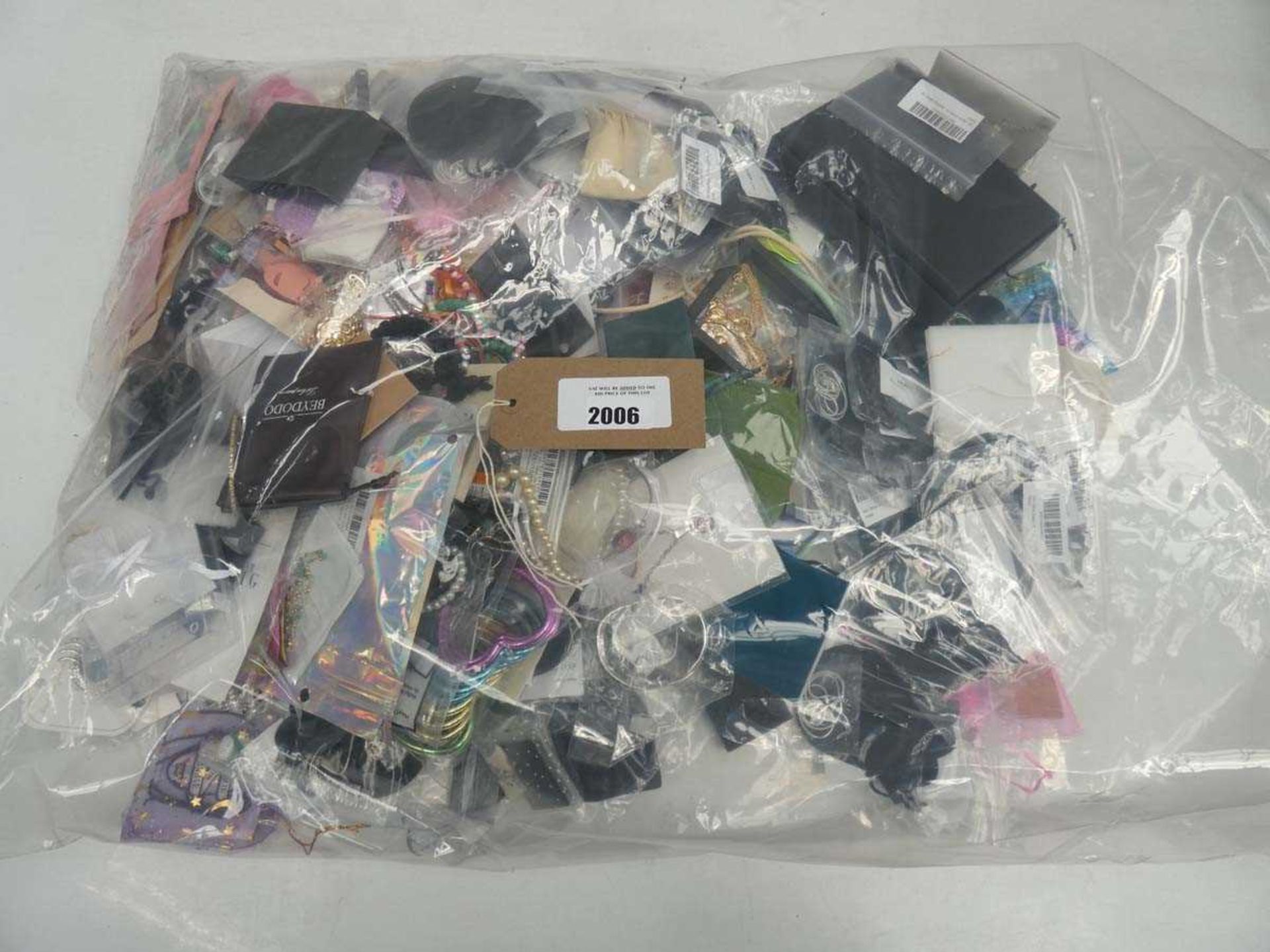 +VAT Bag containing quantity of loose costume and dress jewellery