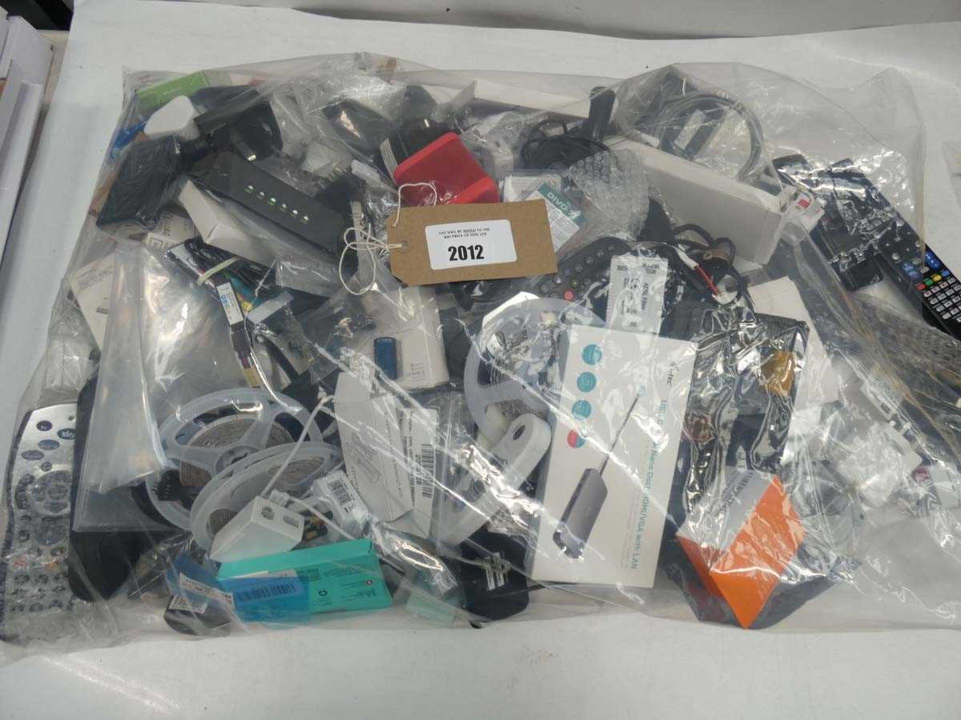+VAT Mixed lot containing sundries and electrical devices/accessories; remotes, adapters, LED