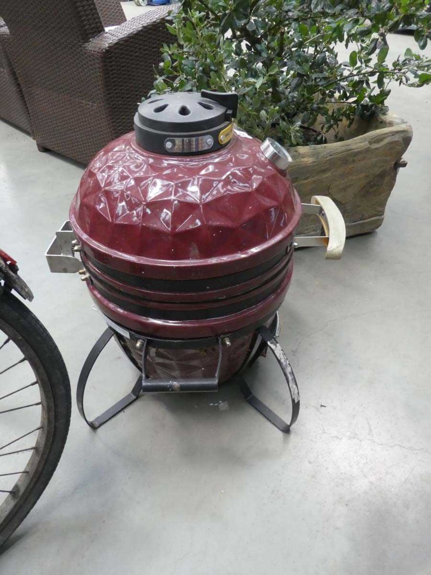 Ceramic charcoal barbeque in burgundy