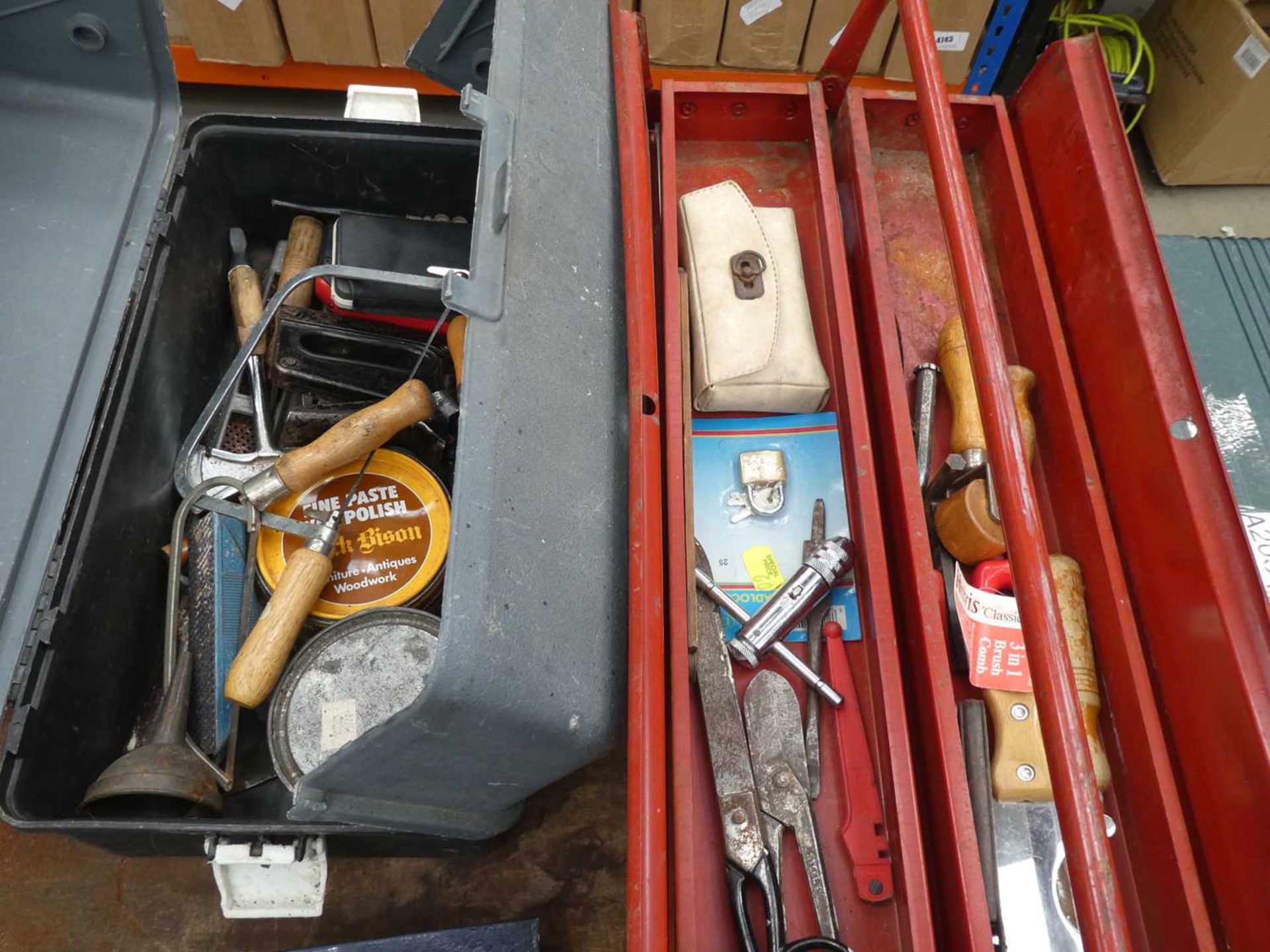 Cantilever toolbox with various tools and grey plastic toolbox with various tools