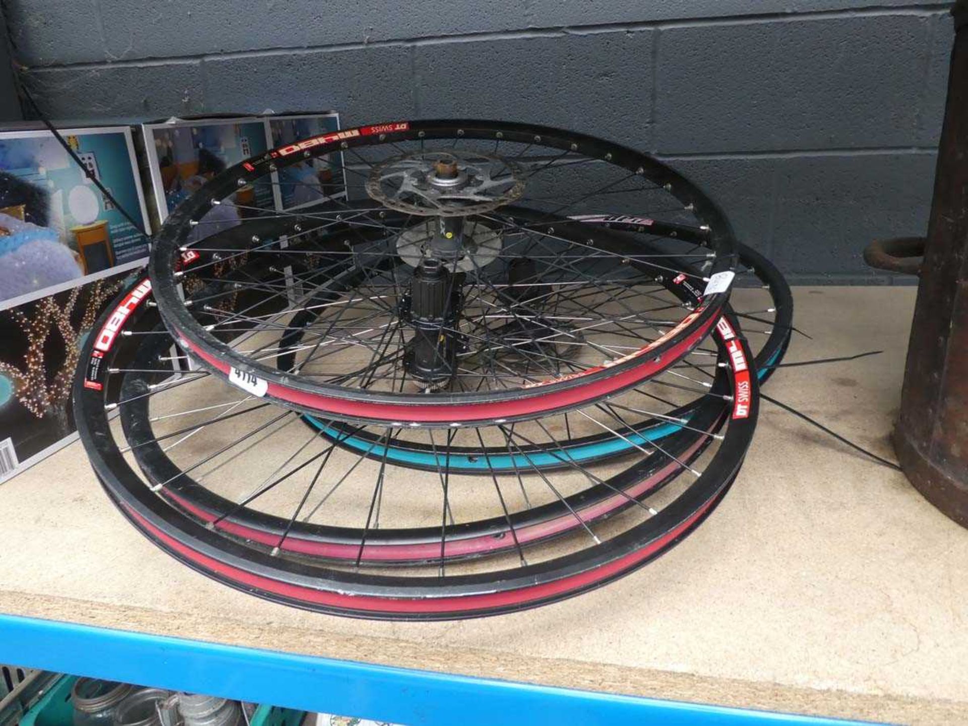 4 assorted bike wheels