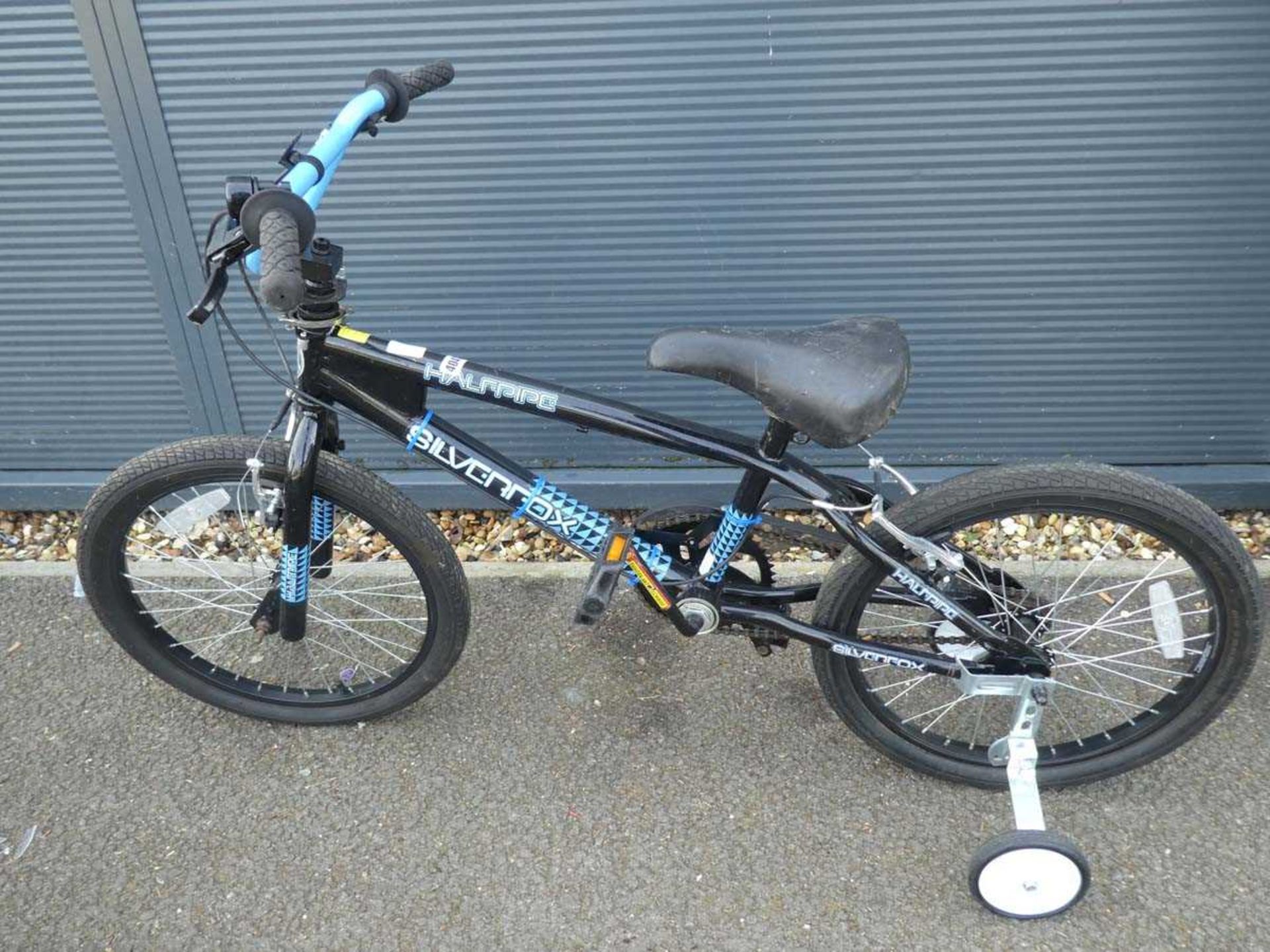 Small childs bike in black with stabilisers