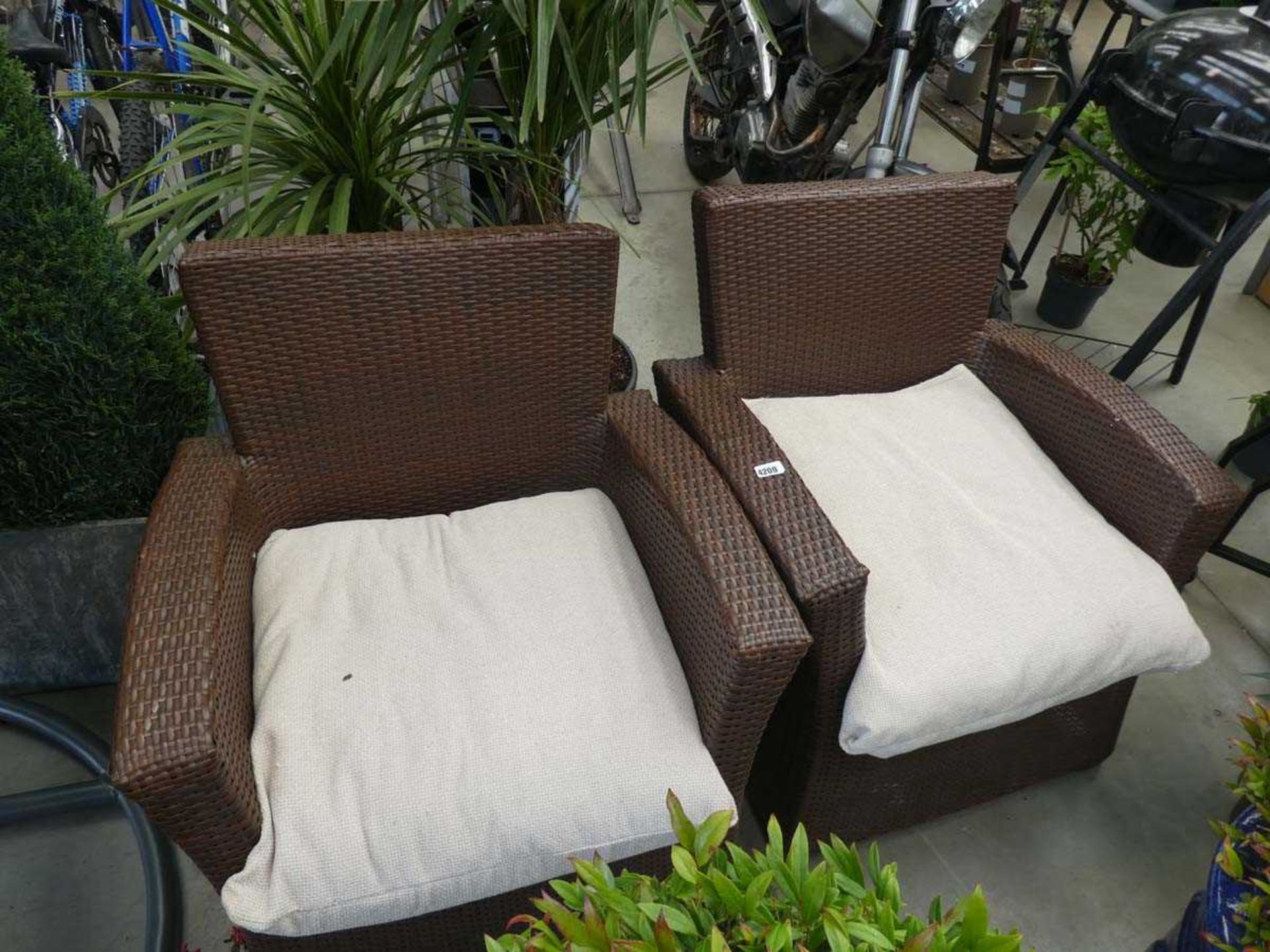 2 rattan chairs with cushions