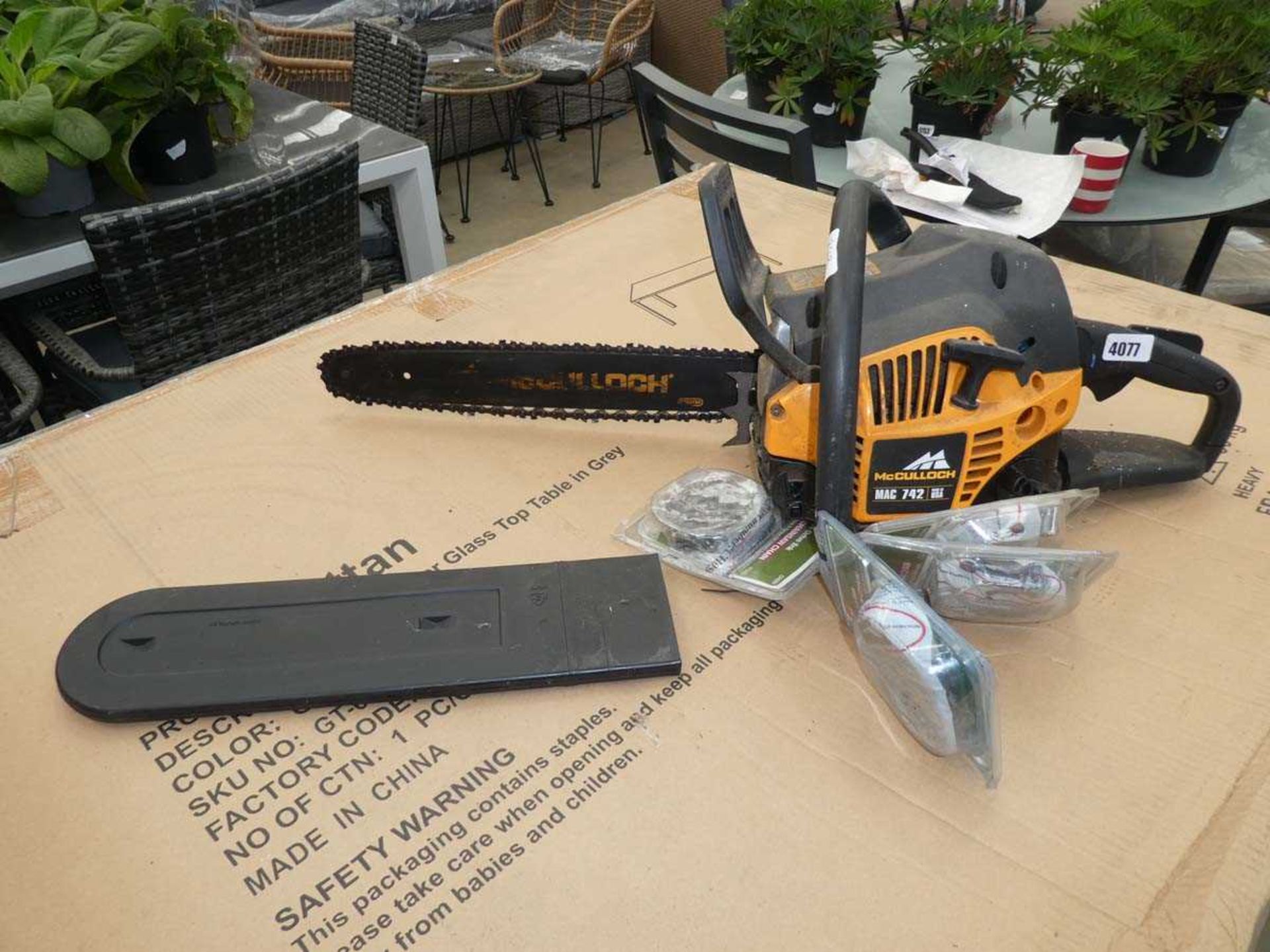 McCullough petrol powered chainsaw with spare blade