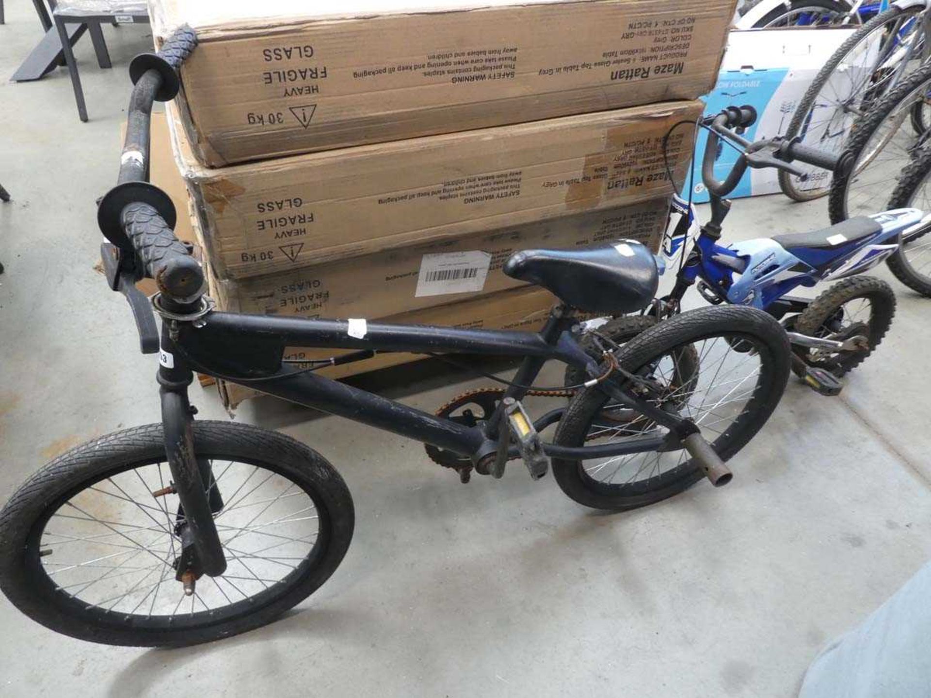 Small black BMX and childs Motorcross style push bike