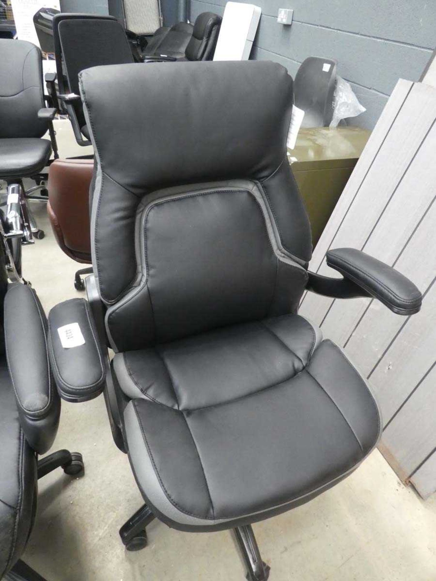 +VAT Black and grey highback executive style swivel armchair