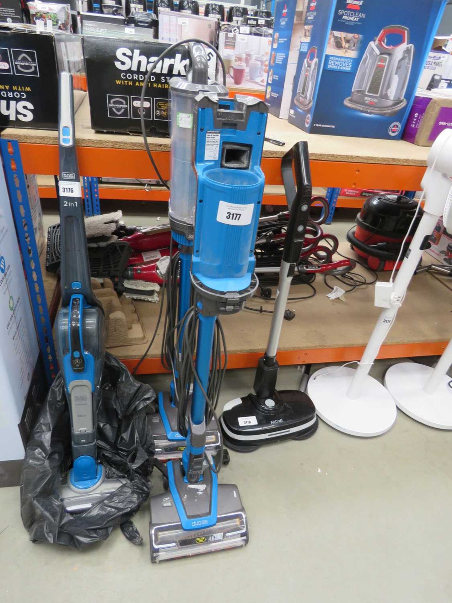 +VAT Two upright Shark corded vacuum cleaners (one is missing the filter)