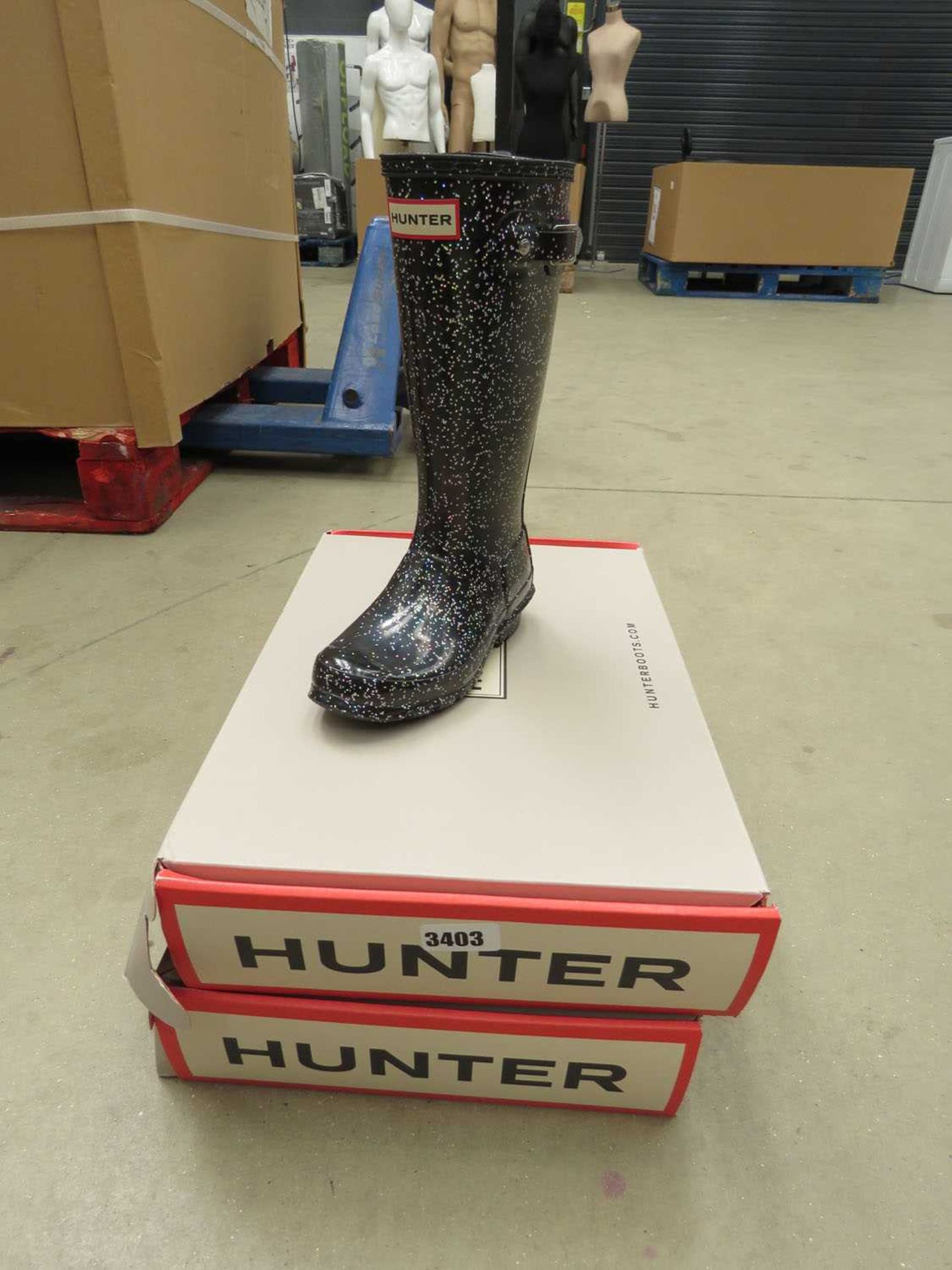 2 boxed pairs of kids Hunter wellies in various styles and sizes
