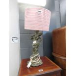 Metal table lamp with shade and figure to the column