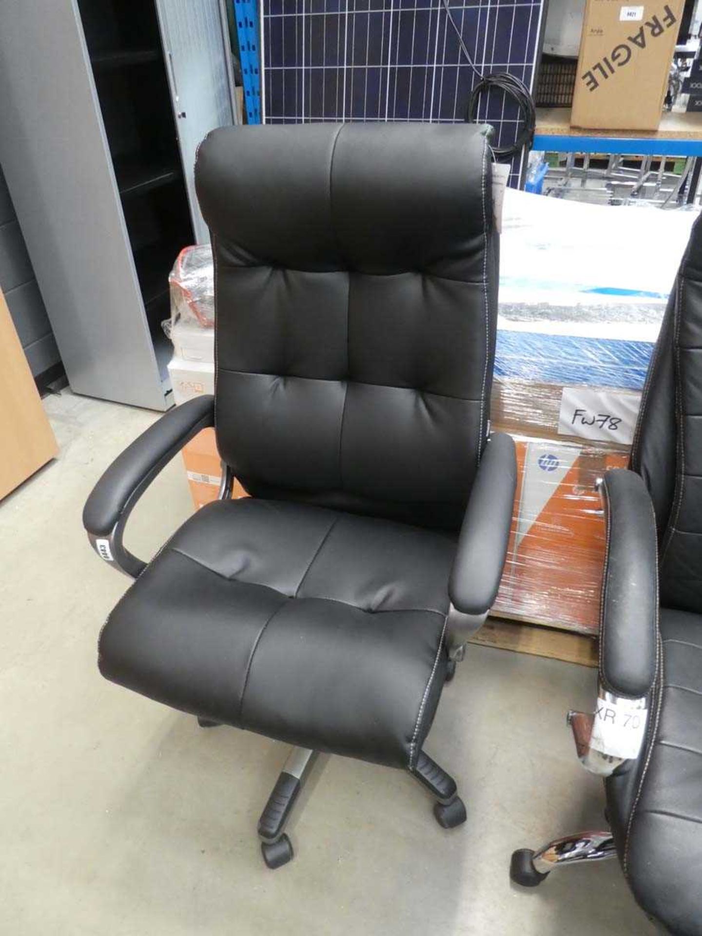 Black swivel armchair