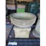 Large concrete bowl on concrete plinth