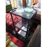 Modern black metal framed 4 tier shelving unit with glass shelves