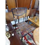 Wrought metal chair with cane seat