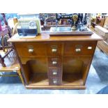 Modern hardwood storage unit with one large drawer and 3 small drawers below