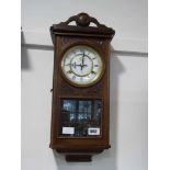 Dark oak cased wall clock by The Time MFG Co.
