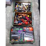 Three shallow trays of various Action Man model toys, and model trains
