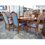 modern cherry effect extending dining table with 6 blue upholstered dining chairs (4+2)