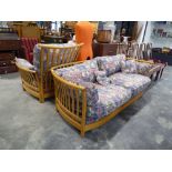 Ercol lounge suite comprising 2 seater sofa with loose geometric patterned cushions and 1 matching