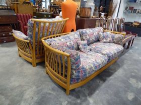 Ercol lounge suite comprising 2 seater sofa with loose geometric patterned cushions and 1 matching