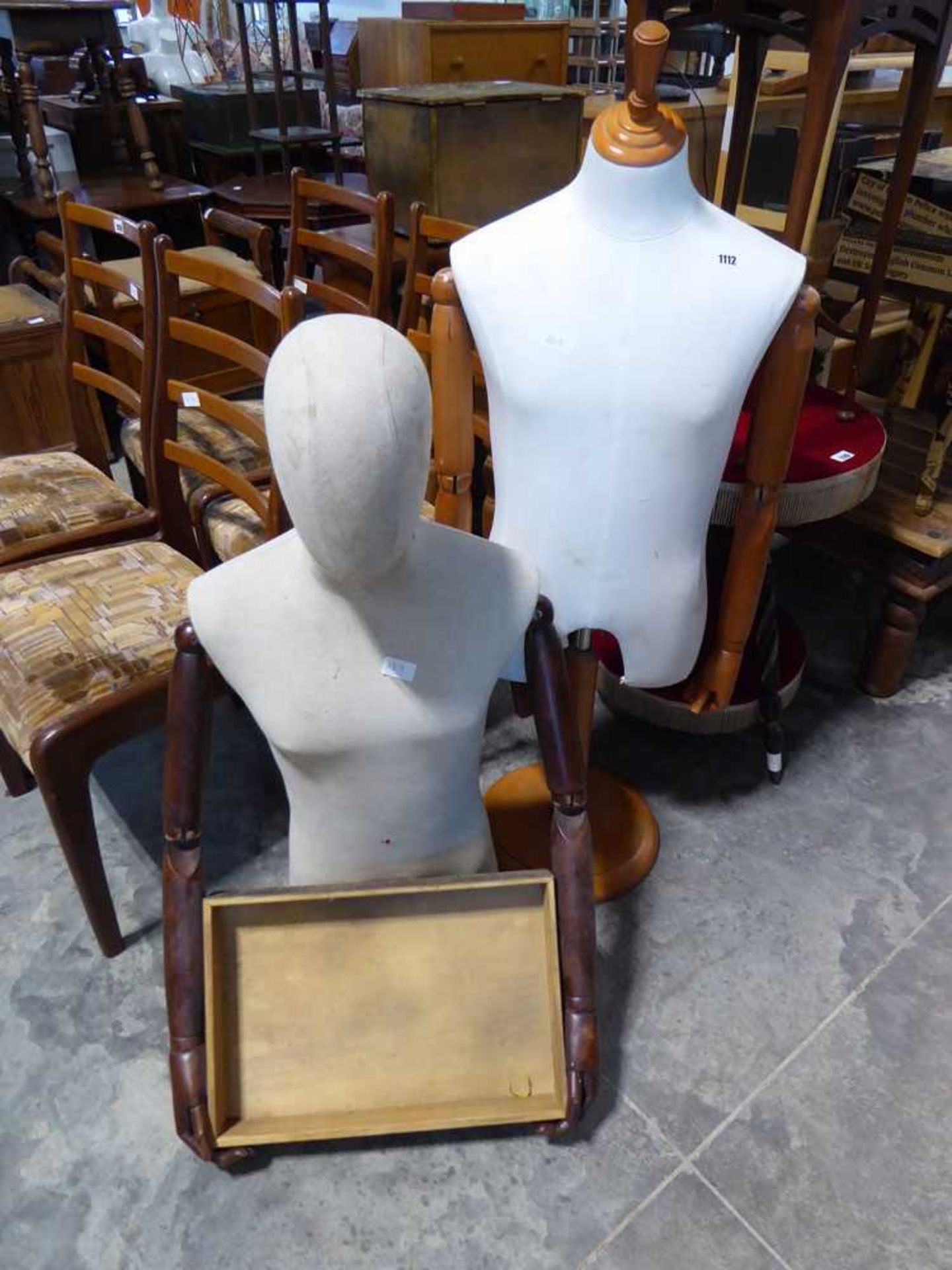 Posable mannequin with wooden jointed arms and fingers, together with a second similar mannequin