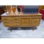 Mid century simulated wood sideboard, together with a similar octagonal glass topped coffee table