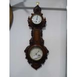 Carved mahogany cased barometer by Lowden & Garro, London