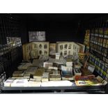 Cage containing a large qty of cigarette cards, neatly sorted into sets