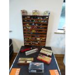 Die cast display stand containing die cast tradesman's vehicles, buses, fire engines, etc. with