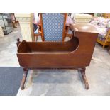 Georgian mahogany rocking crib on stand