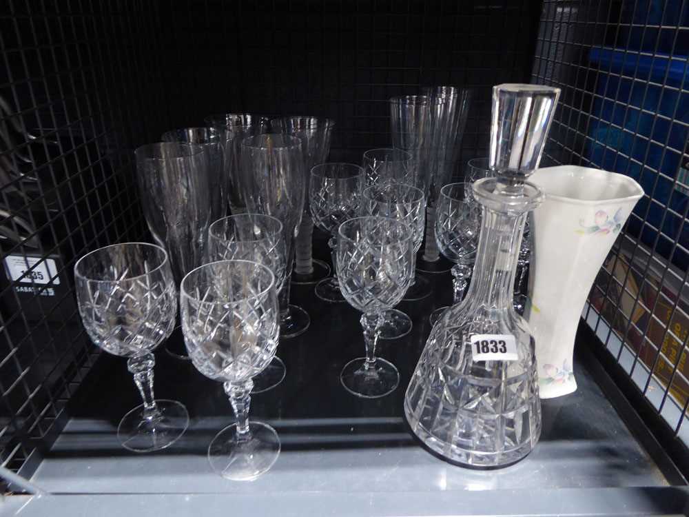 Cage conataining various cut glass including decanter, champagne flutes, etc