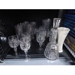 Cage conataining various cut glass including decanter, champagne flutes, etc