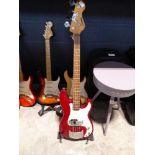 Encore bass guitar in red with guitar stand
