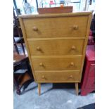 Mid century oak chest of 4 drawers raised on tapered supports