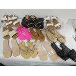 +VAT A bag containing 11 pairs of sandals in various styles and sizes