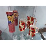 Graduated set of 3 Heron ware jugs, 1 further mug and 2 English floral patterned jugs