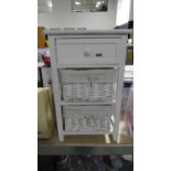 White wooden side table with one drawer at the top and 2 baskets under