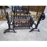 Wrought iron fire grate with dogs