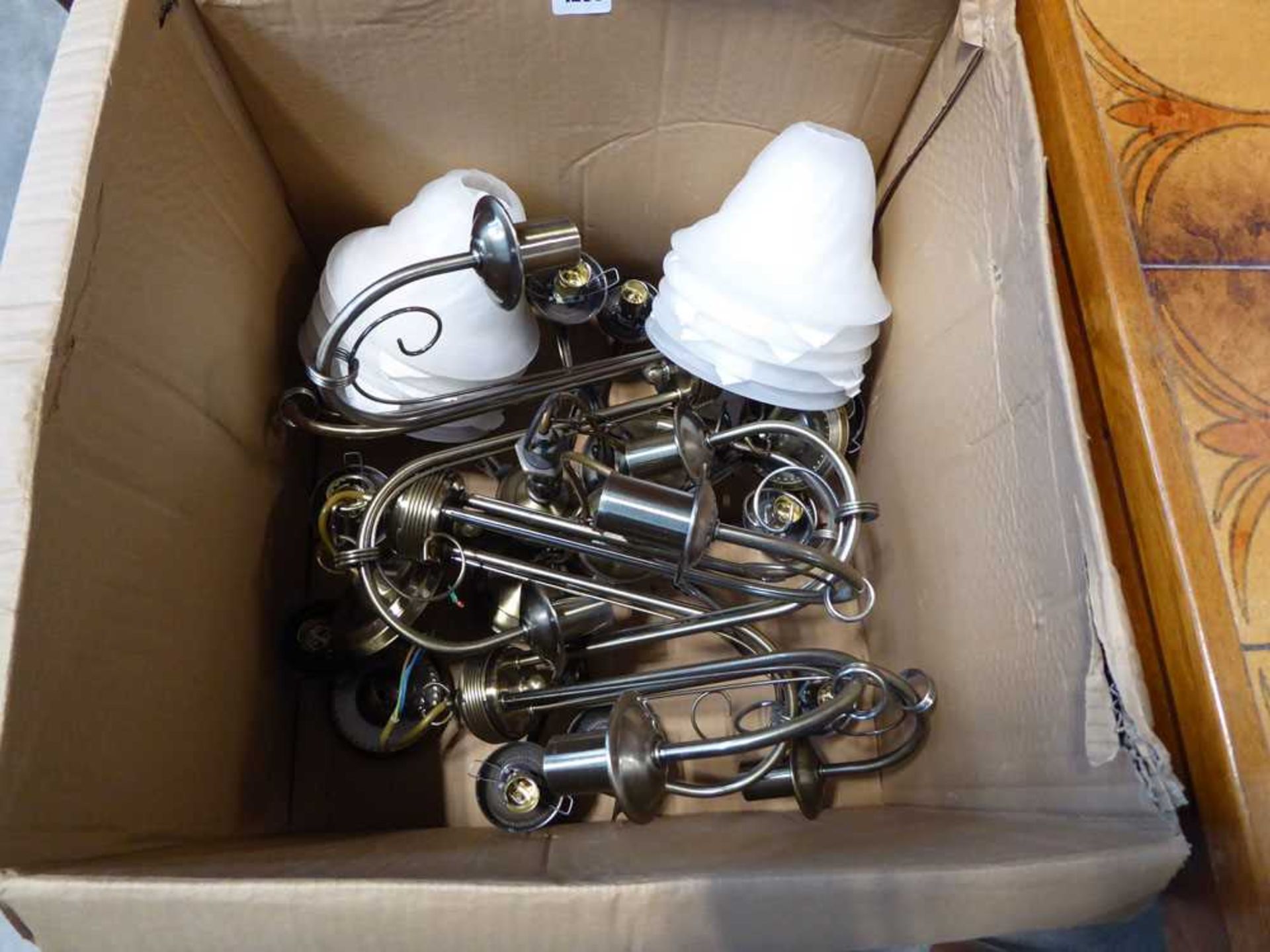 Box containing metal ceiling light fittings with glass shades