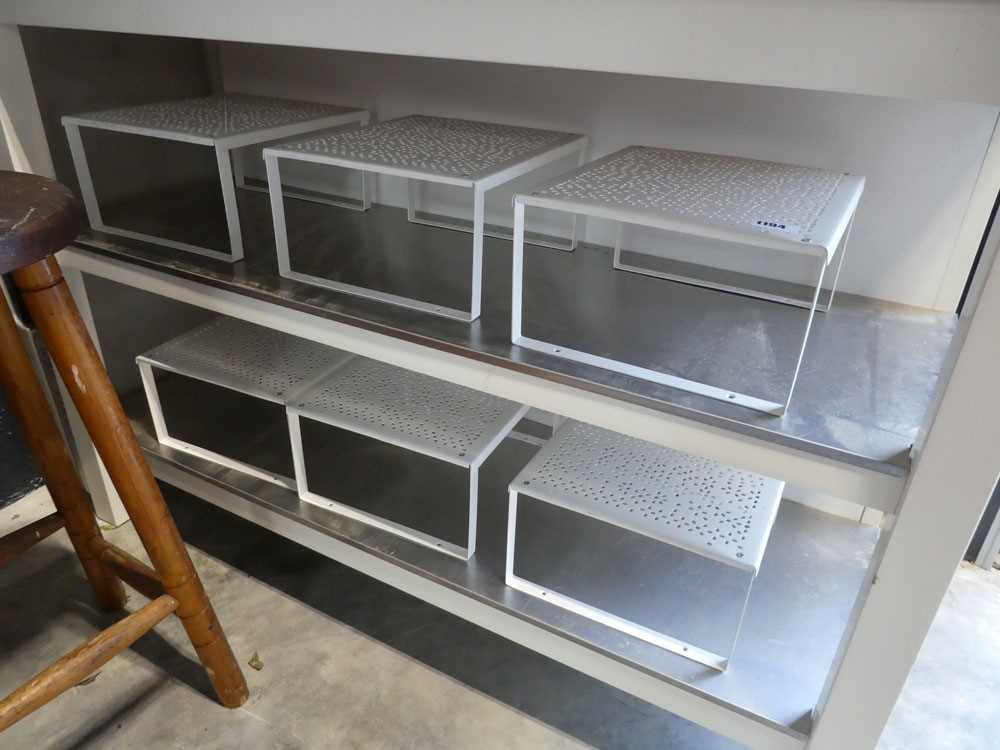 6 perforated white metal stands