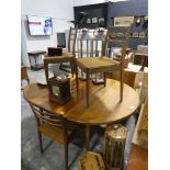 Mid-century teak extending circular dining table with 4 matching dining chairs