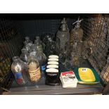 Two soda streams, various beer steins, advertising milk bottles, Guiness letter racks etc.