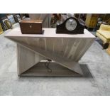 Modern geometric shaped side table in a limed wood effect
