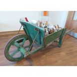 19th Century French provincial oak wheelbarrow containing a hamper of fine food and wines. All