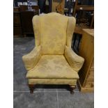 Yellow floral upholstered wing back easy chair