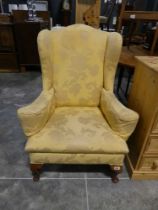 Yellow floral upholstered wing back easy chair